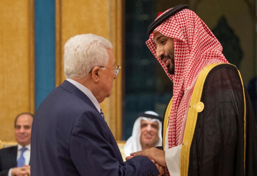 Crown Prince of Muhammad Bin Salman and Palestinian President Mahmoud Abbas shake hands during the14th Islamic summit of the Organization of Islamic Cooperation (OIC) in Makkah early Saturday. — Reuters