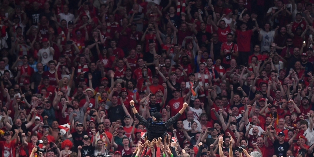 Liverpool fans sing as they celebrate their team's victory after the UEFA Champions League final football match between Liverpool and Tottenham Hotspur at the Wanda Metropolitano Stadium in Madrid on Saturday. — AFP