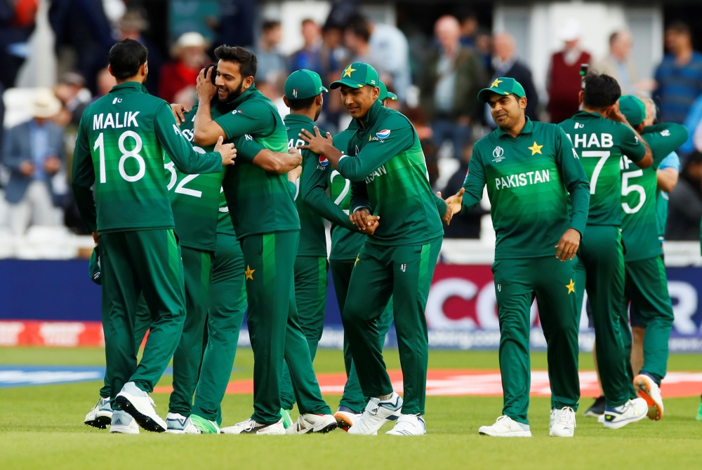 Pakistan celebrates victory over England in the ICC Cricket World Cup at the Trent Bridge, Nottingham, Britain, on Monday. — Reuters