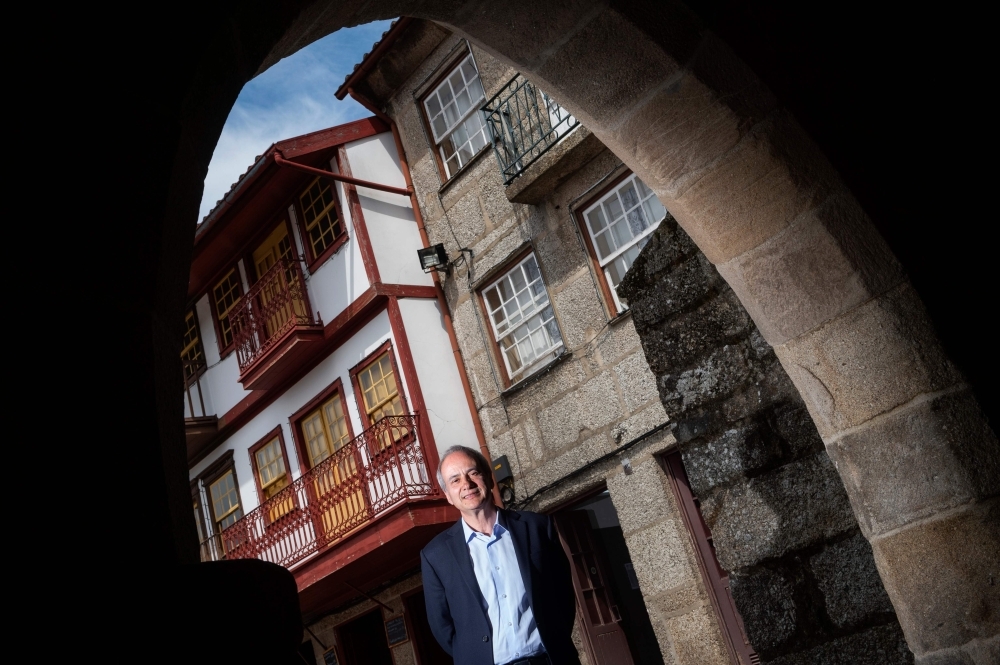 Domingos Bragança, Mayor of Guimaraes, poses at the Sao Tiago square in Guimaraes. The small medieval city of Guimaraes will host the UEFA Nations League semifinal between the Netherlands and England on June 9, 2019. — AFP