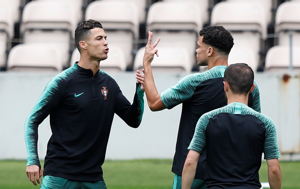 Portugal's Cristiano Ronaldo and Pepe during training for the UEFA Nations League semifinal at the Estadio do Bessa, Porto, Portugal. — Reuters