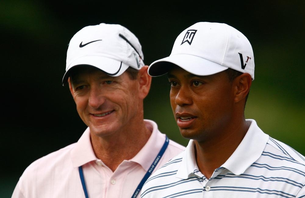 Veteran golf coach Hank Haney, left, is seen with Tiger Woods, right, in this file picture. — Courtesy photo