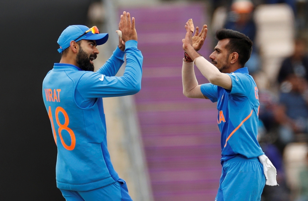 India's Yuzvendra Chahal celebrates with Virat Kohli after taking the wicket of South Africa's Andile Phehlukwayo during an ICC Cricket World Cup against South Africa v at The Ageas Bowl, Southampton, Britain, on Wednesday. — Reuters