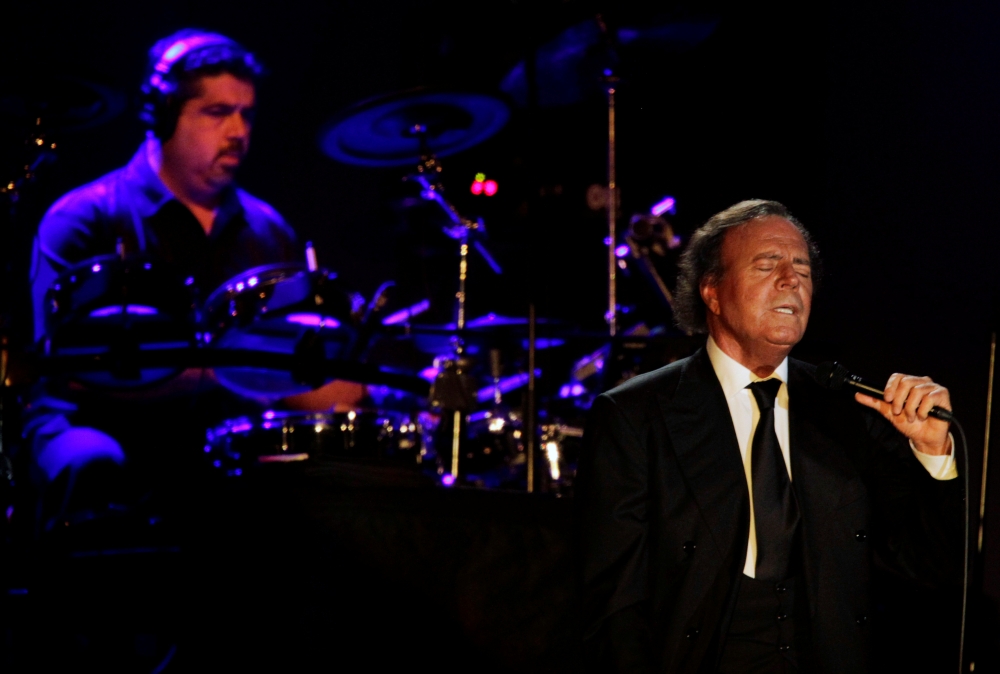 Spanish singer Julio Iglesias performs during a concert at the Conmebol Convention Center in Luque, near Asuncion, Paraguay, in this  April 29, 2012 file photo. — Reuters