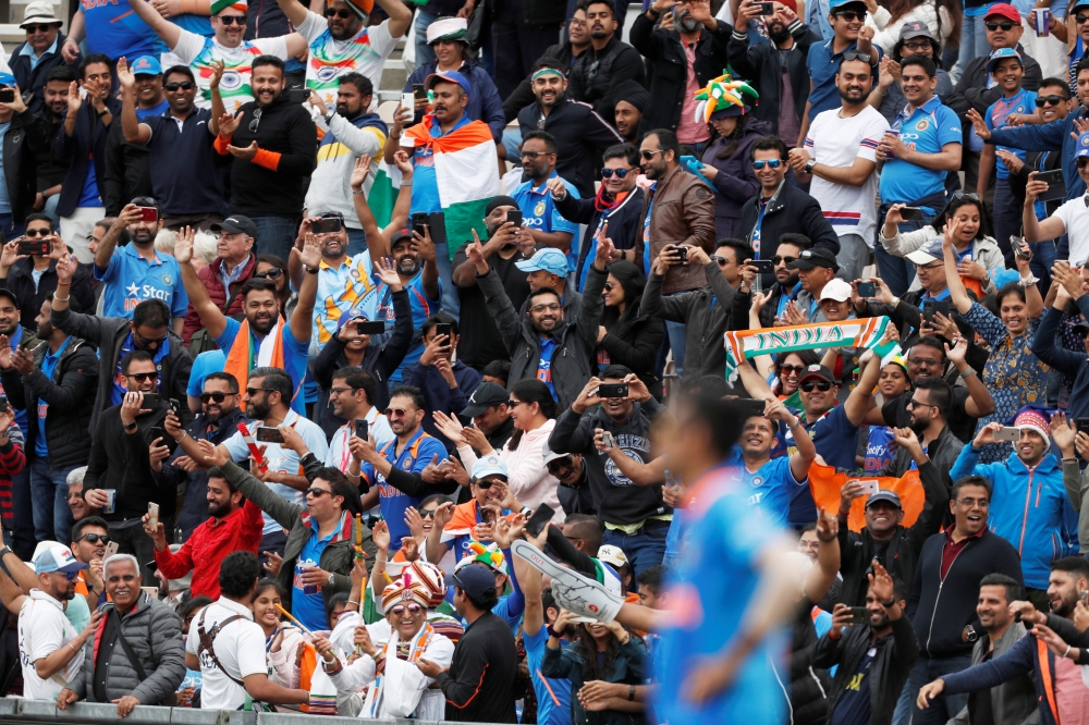 India fans cheer their side against South Africa during the ICC Cricket World Cup match at The Ageas Bowl, Southampton, Britain, on Wednesday. — Reuters