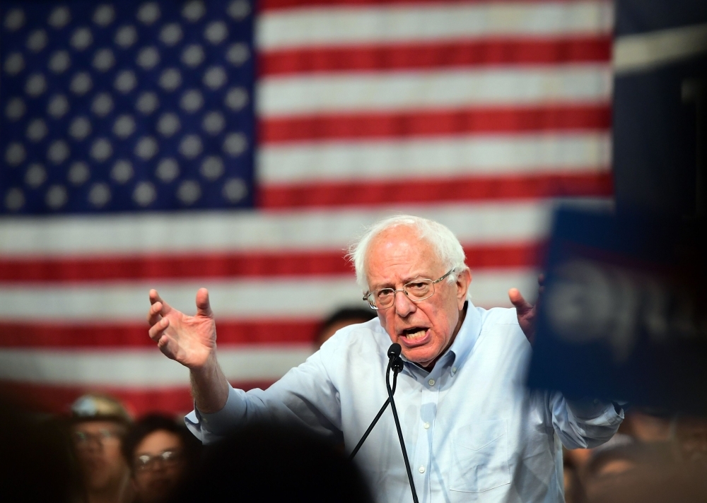 In this file photo taken on May 31, 2019, US presidential candidate Bernie Sanders addresses a rally at the Pasadena Convention Center in Pasadena, California. Sanders confronted the world's biggest retailer on Wednesday, entering Walmart's shareholder meeting and accusing top executives of paying 