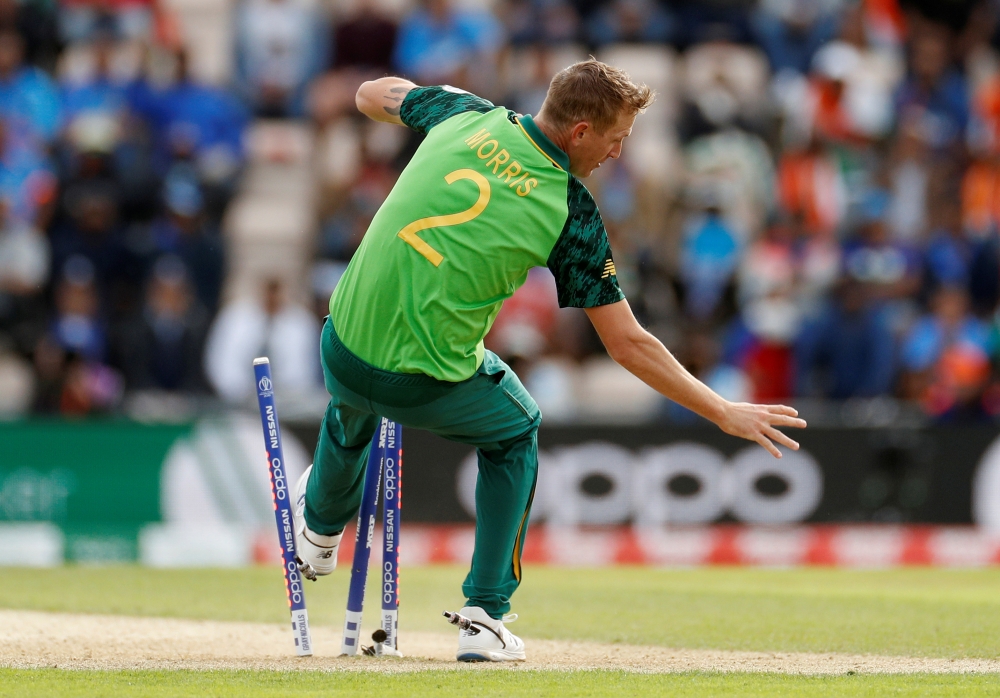 South Africa's Chris Morris knocks over the stumps as he takes the catch to dismiss India's MS Dhoni during the ICC Cricket World Cup match at The Ageas Bowl, Southampton, Britain, on Wednesday — Reuters/John Sibley