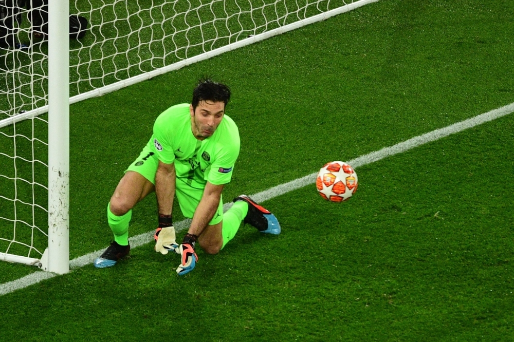 In this file photo taken on March 6, 2019 Paris Saint-Germain's Italian goalkeeper Gianluigi Buffon fails to catch the ball during the UEFA Champions League round of 16 second-leg football match against Manchester United at the Parc des Princes stadium in Paris. — AFP