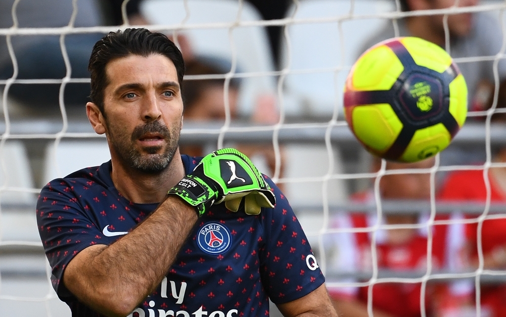 In this file photo taken on March 6, 2019 Paris Saint-Germain's Italian goalkeeper Gianluigi Buffon fails to catch the ball during the UEFA Champions League round of 16 second-leg football match against Manchester United at the Parc des Princes stadium in Paris. — AFP