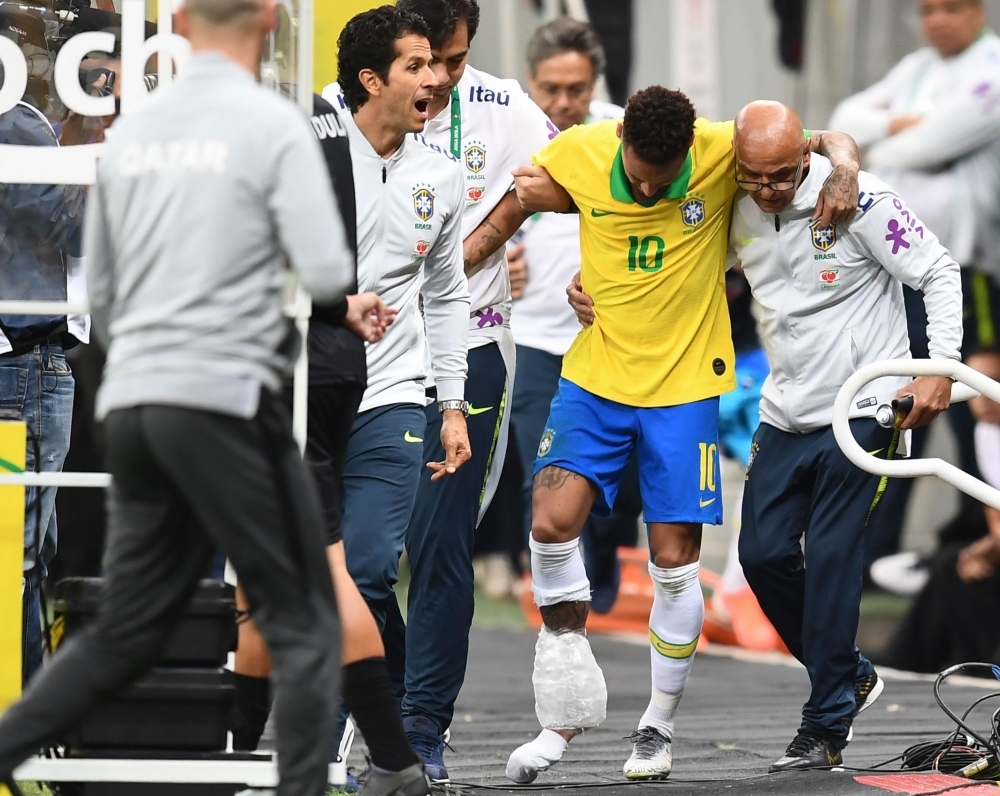 Brazil's Neymar leaves the pitch injured during a friendly football match against Qatar at the Mane Garrincha stadium in  on Wednesday, ahead of Brazil 2019 Copa America. — AFP