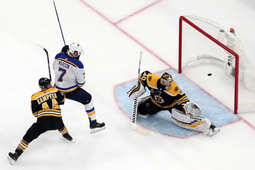 A shot goes past Tuukka Rask No. 40 of the Boston Bruins against Pat Maroon #7 of the St. Louis Blues during the third period in Game Five of the 2019 NHL Stanley Cup Final at TD Garden on Thursday in Boston, Massachusetts. — AFP