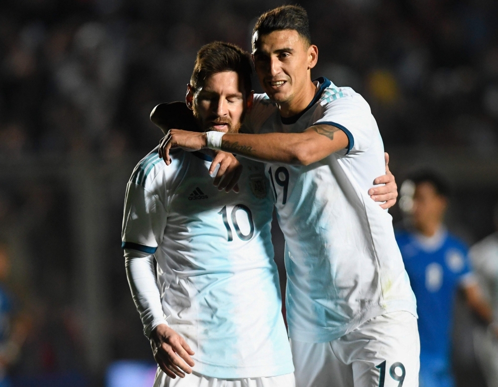 Argentina's Lionel Messi (C) is marked by Nicaragua's Josue Quijano (L) and Luis Fernando Copete during their international friendly football match at the San Juan del Bicentenario stadium in San Juan, Argentina, on Friday. — AFP
