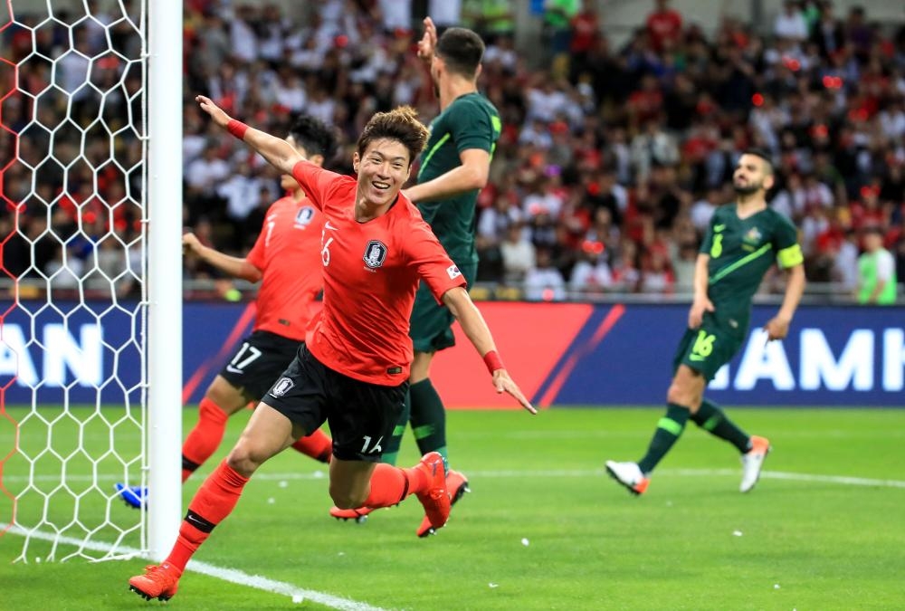 South Korea's Hwang Ui-jo (front) celebrates his goal against Australia during a friendly football match in Busan on Frdiay. — AFP