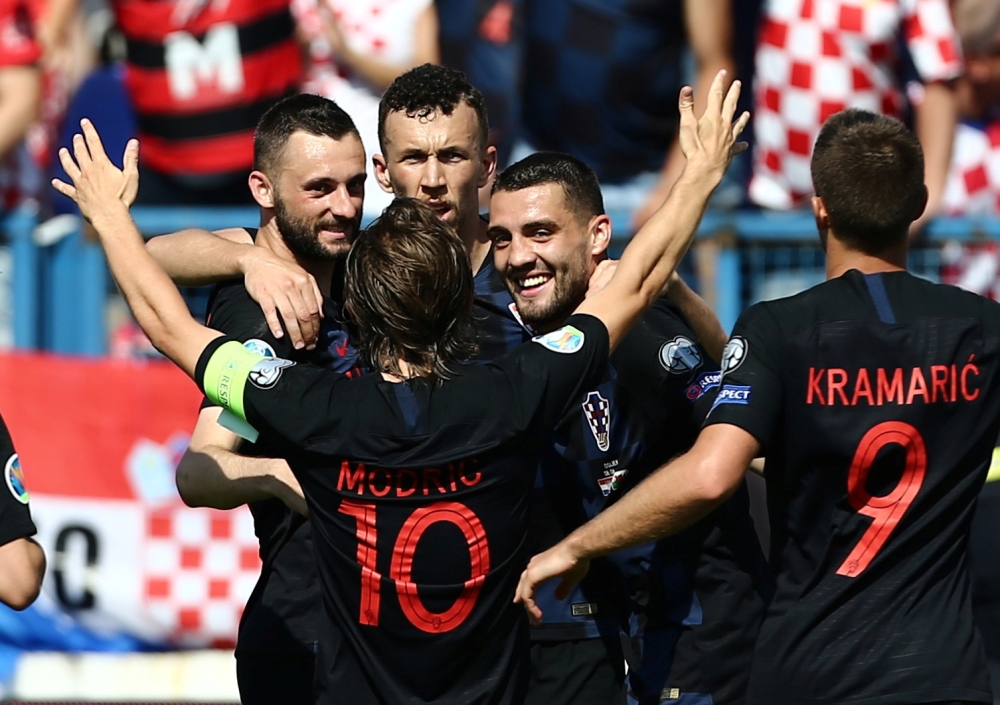 Croatia's forward Ivan Perisic (R) vies with Wales' midfielder Joe Allen during the Euro 2020 qualification football match between Croatia and Wales at Gradski vrt stadium in Osijek, Croatia, on Saturday. — AFP