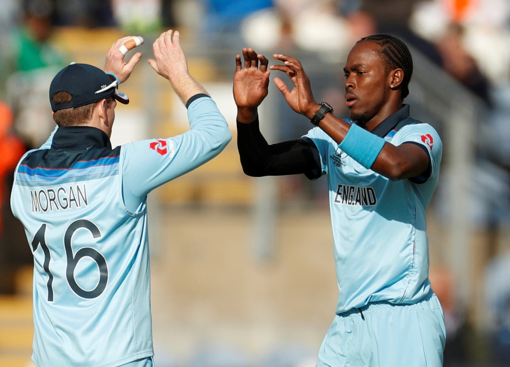 England's Jason Roy runs into and knocks the umpire over as he celebrates reaching a century against Bangladesh during the ICC Cricket World Cup match at the Cardiff Wales Stadium, Cardiff, Britain — Reuters