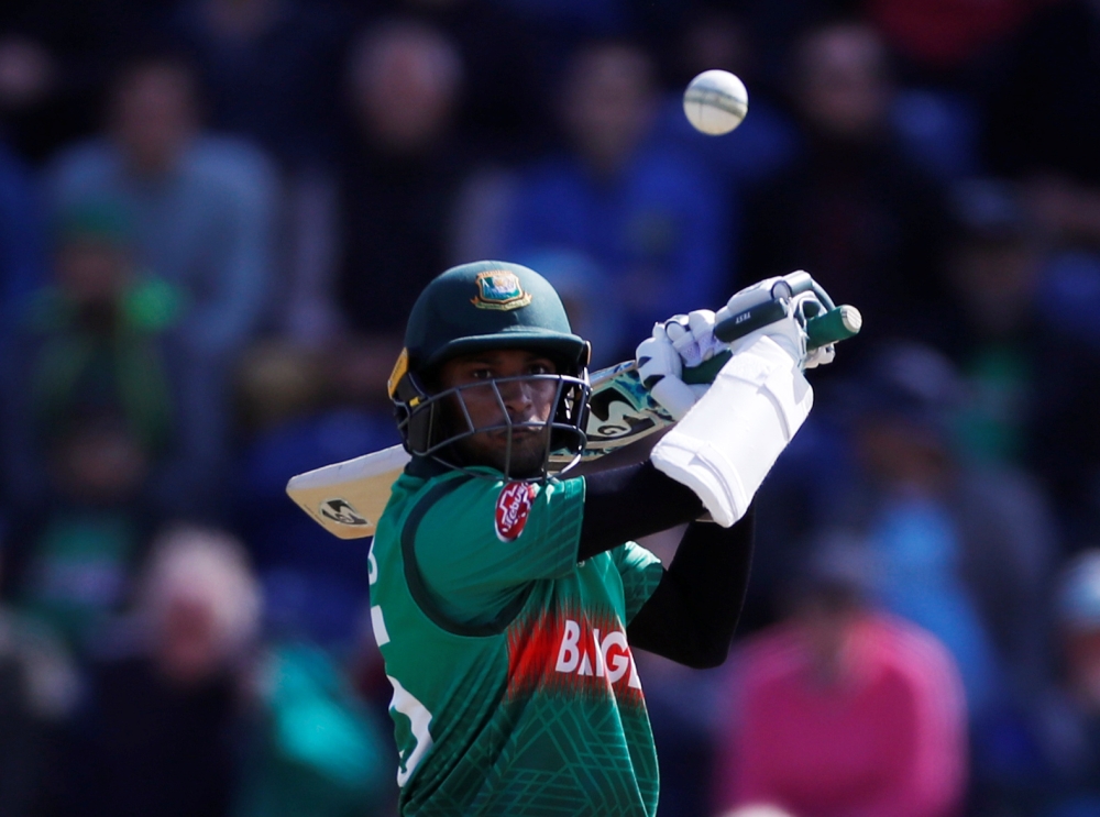 England's Jason Roy runs into and knocks the umpire over as he celebrates reaching a century against Bangladesh during the ICC Cricket World Cup match at the Cardiff Wales Stadium, Cardiff, Britain — Reuters