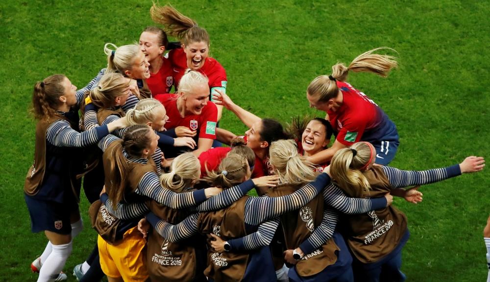 Norway players celebrate their third goal  — Reuters