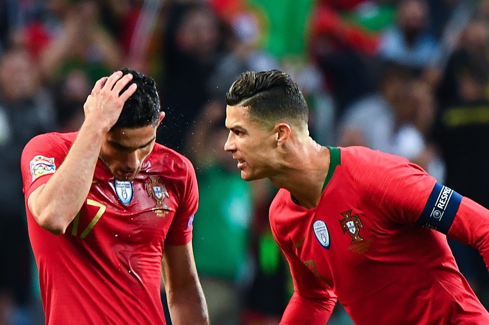 Portugal's Cristiano Ronaldo and teammates celebrate winning the UEFA Nations League Final with the trophy at the Estadio do Dragao, Porto, Portugal, on Sunday. — Reuters