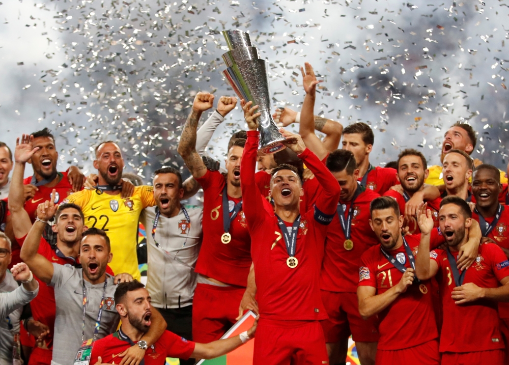 Portugal's Cristiano Ronaldo and teammates celebrate winning the UEFA Nations League Final with the trophy at the Estadio do Dragao, Porto, Portugal, on Sunday. — Reuters