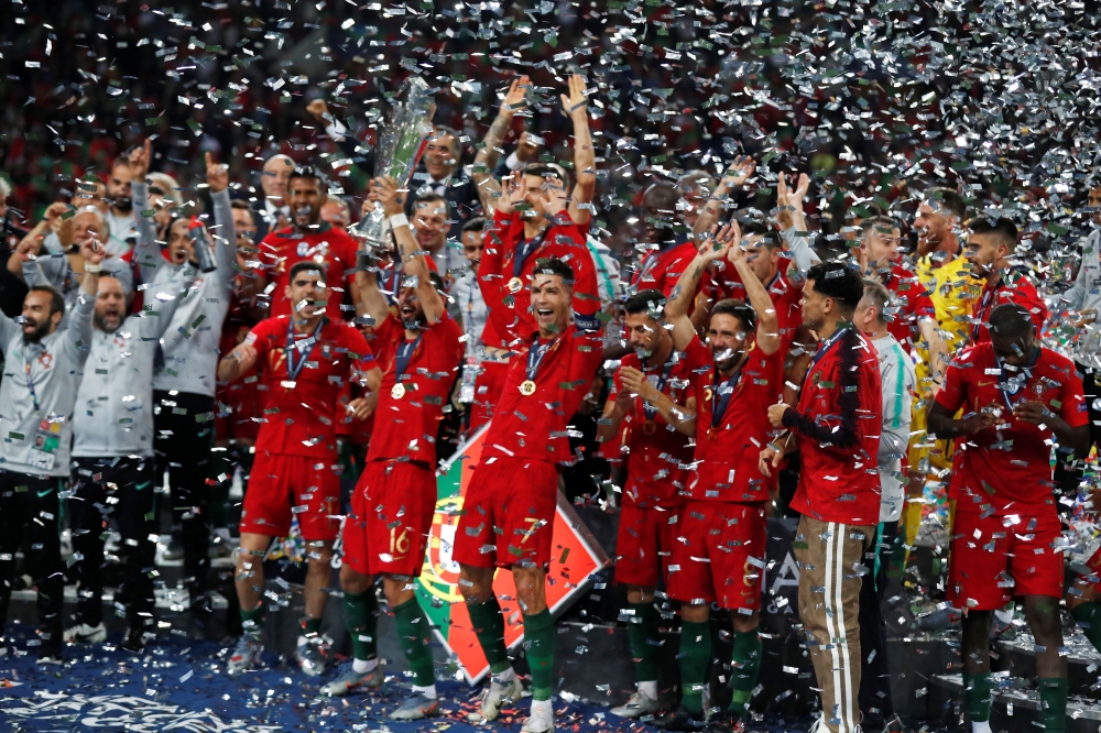 Portugal's Cristiano Ronaldo and teammates celebrate winning the UEFA Nations League Final with the trophy at the Estadio do Dragao, Porto, Portugal, on Sunday. — Reuters