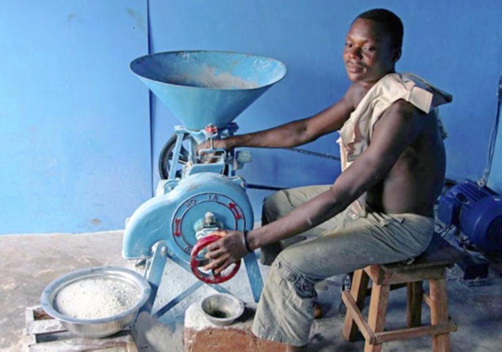 A man works on a solar-powered milling machine in Sikpe Afidegnon village, Togo, May 16, 2019.  — Reuters