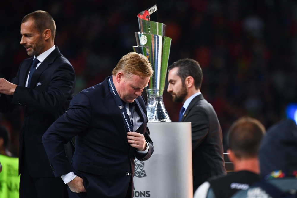 Netherlands' coach Ronald Koeman walks past the trophy after the UEFA Nations League final football match between Portugal and The Netherlands at the Dragao Stadium in Porto on Sunday. — AFP