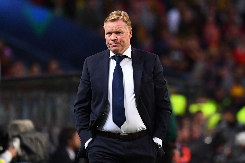 Netherlands' coach Ronald Koeman walks past the trophy after the UEFA Nations League final football match between Portugal and The Netherlands at the Dragao Stadium in Porto on Sunday. — AFP