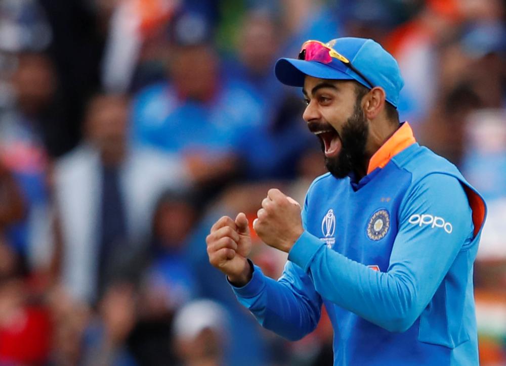 India's Virat Kohli celebrates as India win the match against Australia in the ICC Cricket World Cup at The Oval, London, Britain, on Sunday. — Reuters