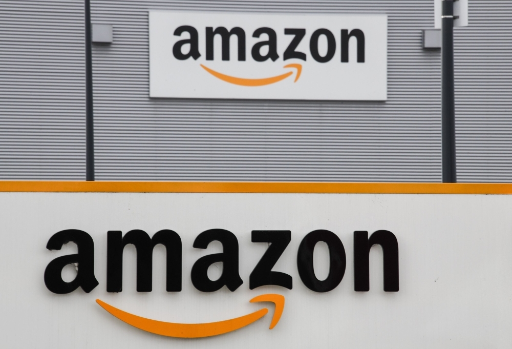 This file photo shows the Amazon logo at the entrance area of the Amazon logistics center in Lauwin-Planque, northern France. — AFP