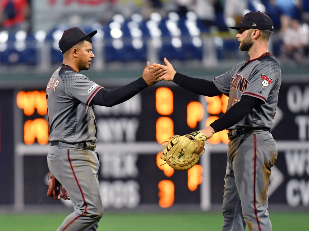 Arizona Diamondbacks' Christian Walker (53) celebrates with David