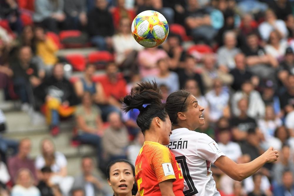 China's defender Haiyan Wu (L) vies for the ball with Germany's midfielder Dzsenifer Marozsan during the France 2019 Women's World Cup Group B football match between Germany and China, on Saturday at the Roazhon Park stadium in Rennes, western France.  — AFP