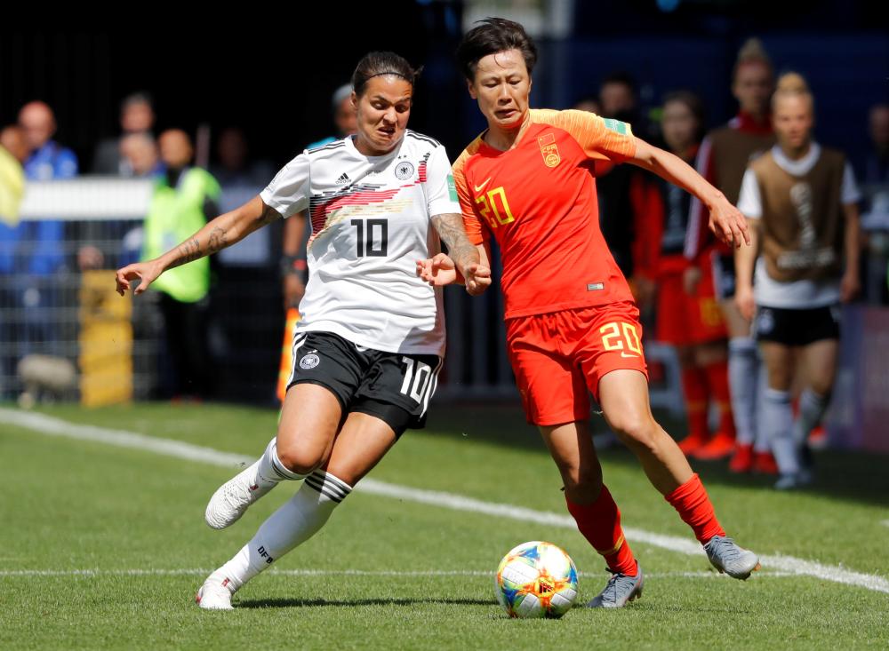 China's defender Haiyan Wu (L) vies for the ball with Germany's midfielder Dzsenifer Marozsan during the France 2019 Women's World Cup Group B football match between Germany and China, on Saturday at the Roazhon Park stadium in Rennes, western France.  — AFP