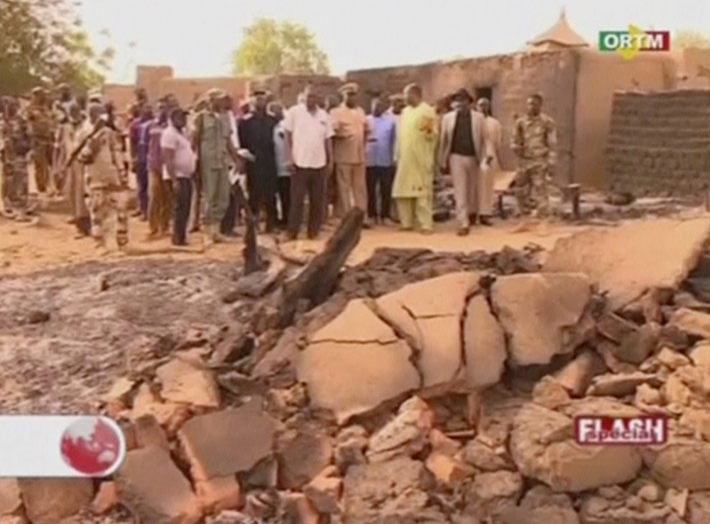 Officials inspect the damage at the site of an attack in the village of Sobame Da, in this still image taken from a footage released by ORTM and shot on Monday, Mali. — Reuters