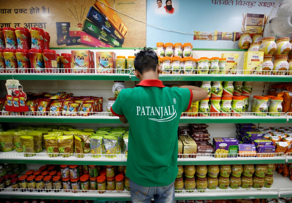 A hoarding with an image of Baba Ramdev is seen inside a Patanjali store in Ahmedabad, India, in this March 28, 2019 photo.  — Reuters