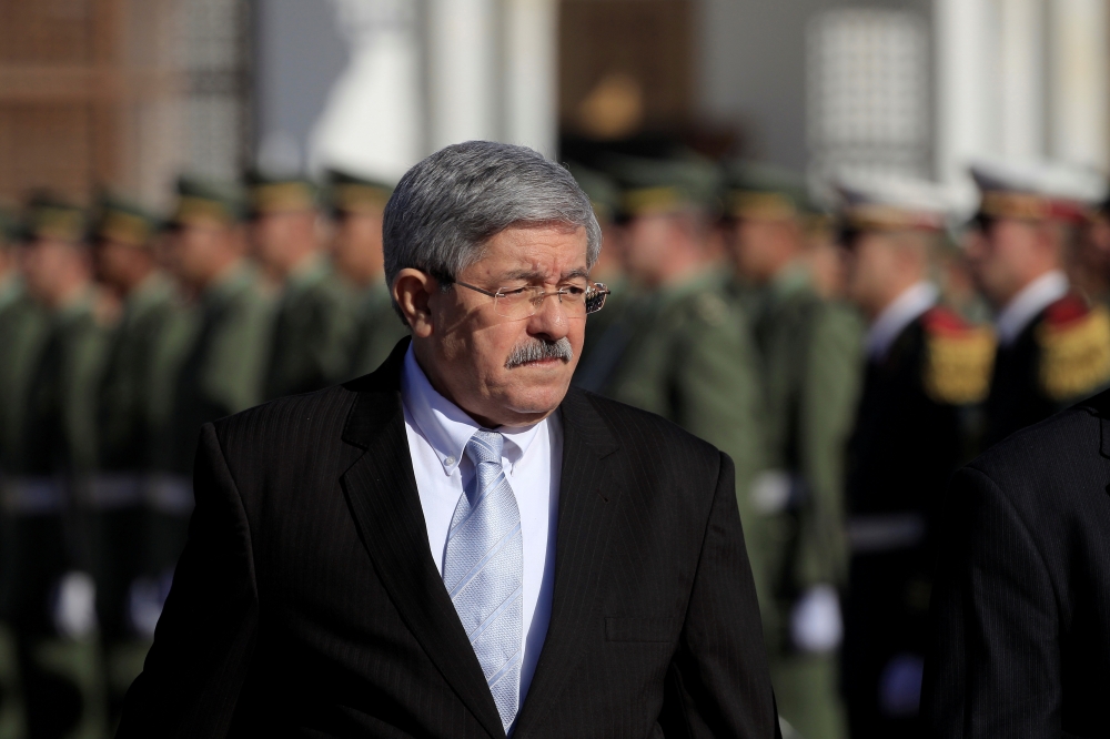 Former Algerian Prime Minister Ahmed Ouyahia awaits the arrival of French President Emmanuel Macron at Houari Boumediene airport in Algiers, Algeria, in this Dec. 6, 2017 file photo. — Reuters