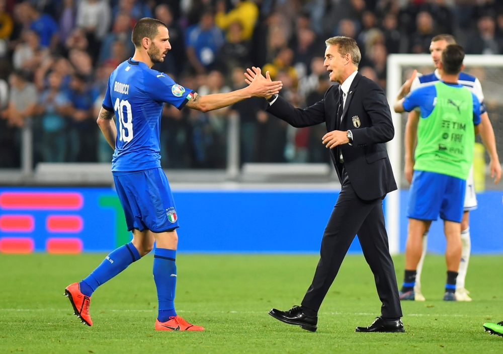 Italy coach Roberto Mancini shakes hands with Leonardo Bonucci after the Euro 2020 Qualifier Group J match against Bosnia and Herzegovina at the Allianz Stadium, Turin, Italy, on Tuesday. — Reuters