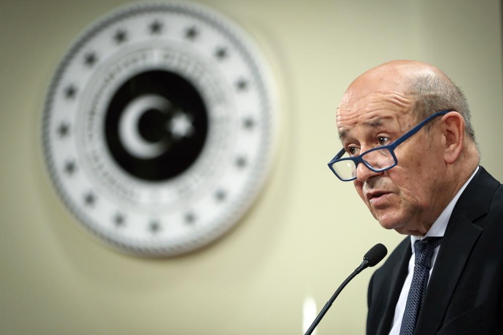 A handout photo shows French Foreign Minister Jean-Yves Le Drian speaking during a press conference with his Turkish counterpart in Ankara, on Thursday. — AFP