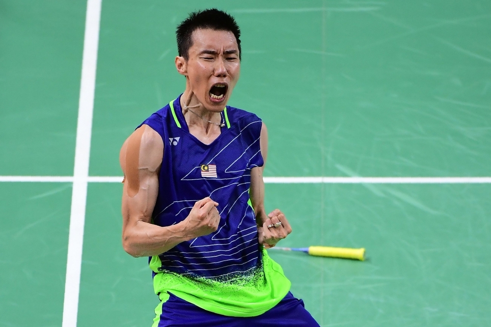Malaysia's badminton player Lee Chong Wei reacts during a press conference to announce his retirement in Putrajaya on Thursday. — AFP