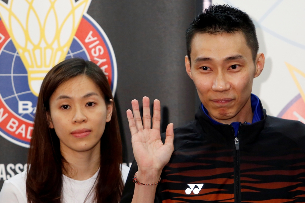 Malaysia's badminton player Lee Chong Wei reacts during a press conference to announce his retirement in Putrajaya on Thursday. — AFP
