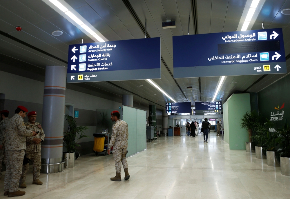 A Saudi security officer walks past the Saudi Arabia's Abha airport, after it was attacked by Yemen's Houthi group in Abha, Saudi Arabia Thursday. – Reuters 