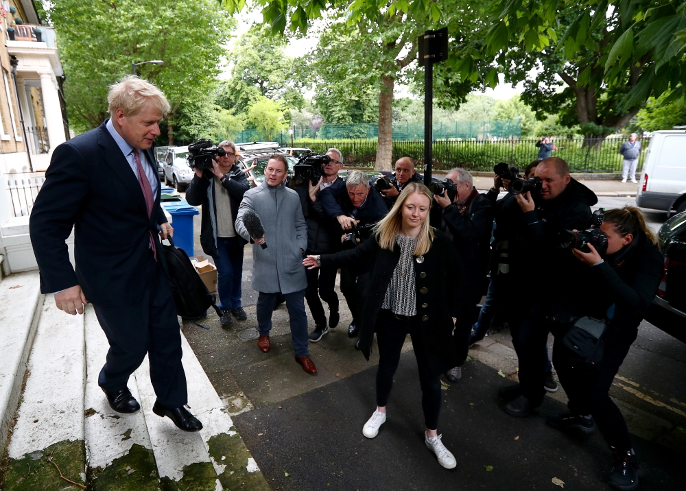 PM hopeful Boris Johnson leaves his home in London, Britain, Friday. — Reuters