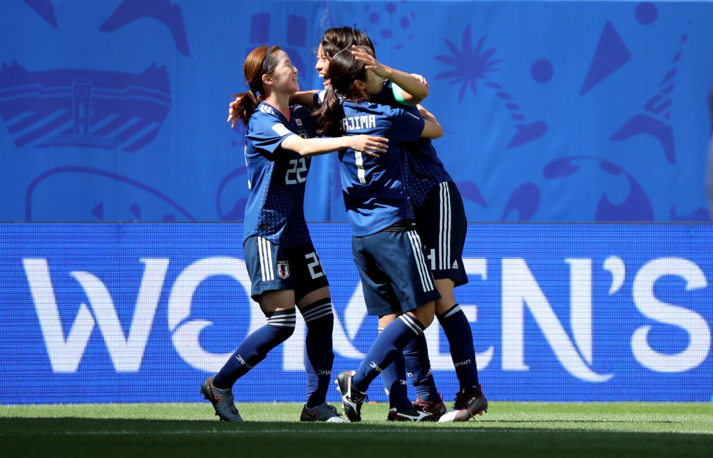 Japan's Saki Kumagai and team mates celebrate after the match. — Reuters