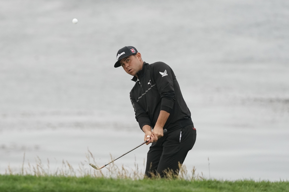 Gary Woodland hits a chip shot on the eighth hole during the second round of the 2019 US Open golf tournament at Pebble Beach Golf Links. — Reuters