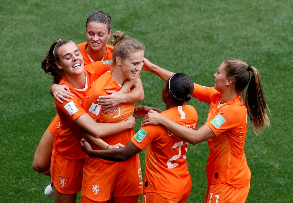 Netherlands' Vivianne Miedema celebrates scoring their third goal against Cameroon with Jill Roord, Lieke Martens and teammates during the France 2019 Women's World Cup Group E football match on Saturday at the Hainaut Stadium in Valenciennes, northern France. — Reuters