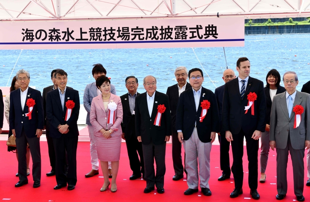 Jean-Christophe Rolland, president of the World Rowing Federation (2nd R) attends the Sea Forest Waterway opening ceremony in Tokyo on Sunday. The new Sea Forest Waterway venue will host rowing and canoe events at the Tokyo 2020 Games. — AFP