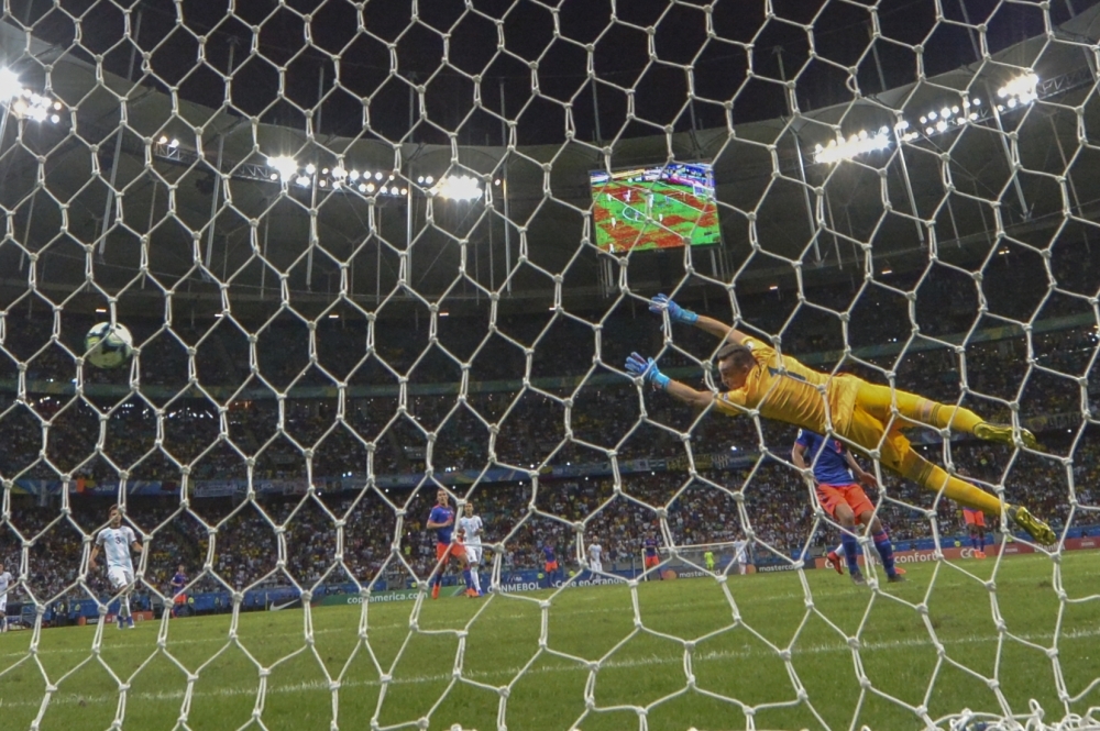 Argentina's goalkeeper Franco Armani can't prevent Colombia's Roger Martinez (out of frame) from scoring during their Copa America football tournament group match at the Fonte Nova Arena in Salvador, Brazil, on Sunday. — AFP