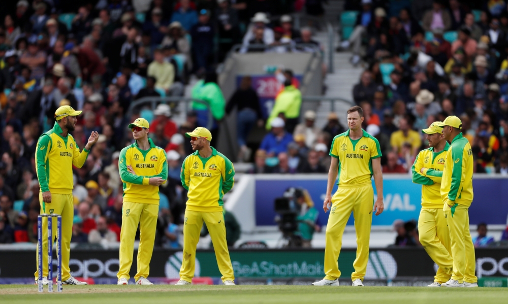 Australia's Steve Smith, David Warner and teammates look on during the ICC Cricket World Cup match against Sri Lanka at the Kia Oval, London, Britain, on Saturday. — Reuters