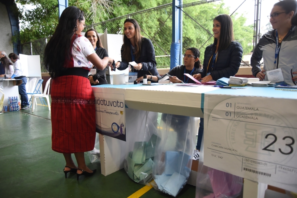 A woman votes at a polling station in Guatemala City on June 16, 2019 during general elections. — AFP