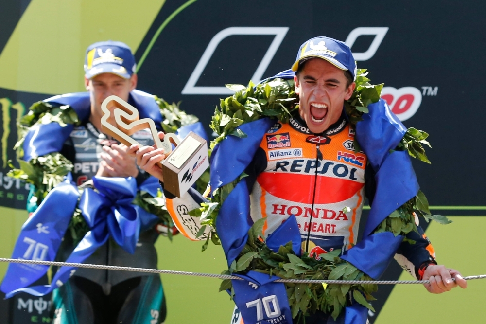 Repsol Honda Team's Spanish rider Marc Marquez celebrates on the podium after winning the Catalunya MotoGP Grand Prix race at the Catalunya racetrack in Montmelo, near Barcelona, on Sunday. — AFP