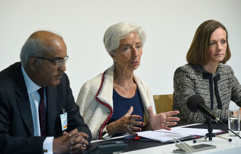 International Monetary Fund (IMF) managing Director Christine Lagarde (C) speaks during a press conference during an Eurogroup meeting at the EU headquarters in Luxembourg. — AFP